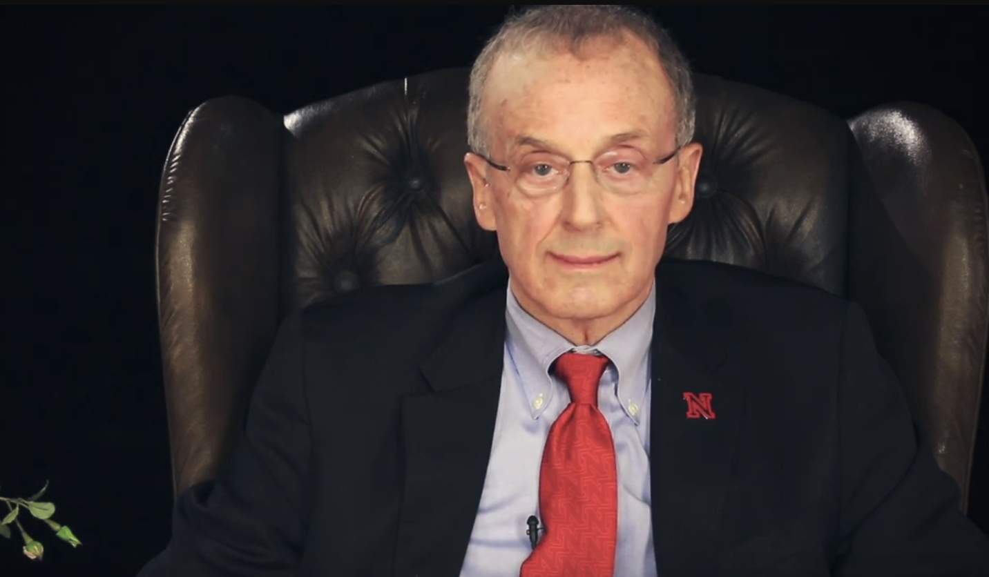 Perlman with a forced smile